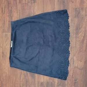 Blue skirt. Above the knee,  skies are blue medium